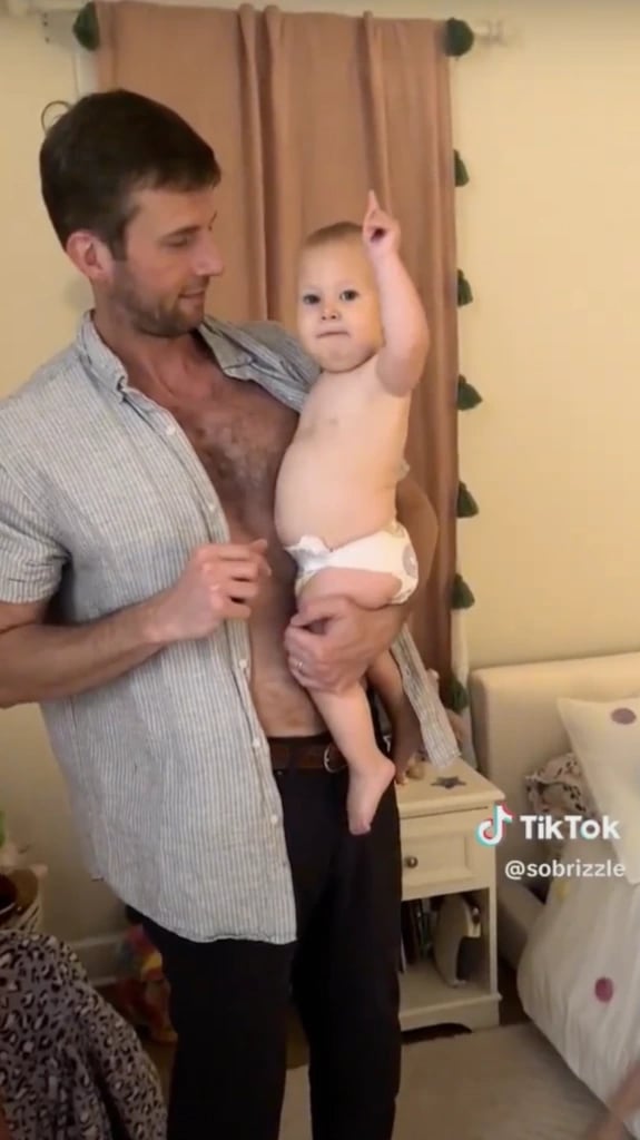 Baby raising her hand in the viral TikTok clip that started the Four Seasons Baby campaign