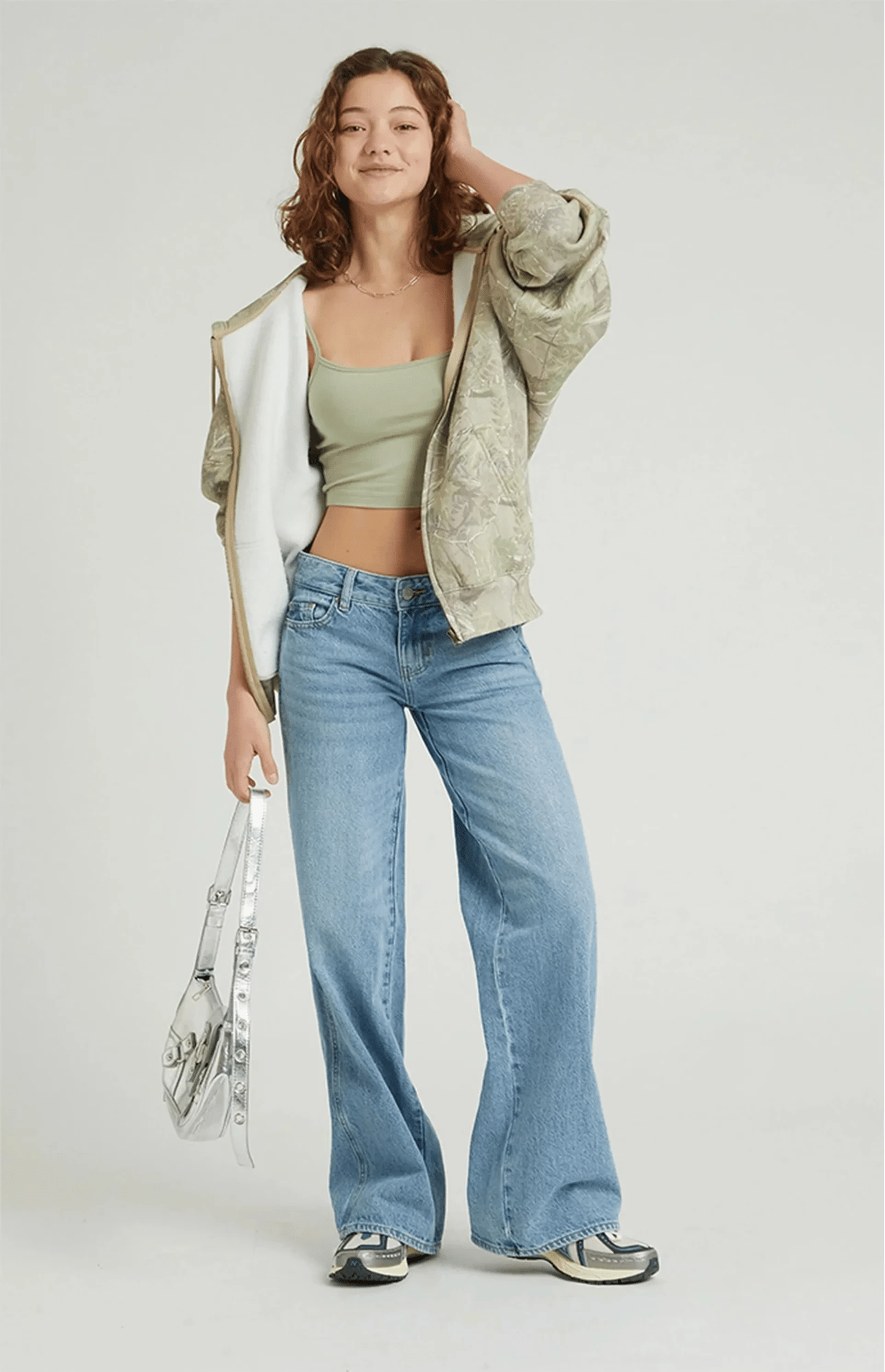 Model wearing PacSun's Casey low-rise baggy jean in the Astrid wash, the pair that sold out after one TikTok video